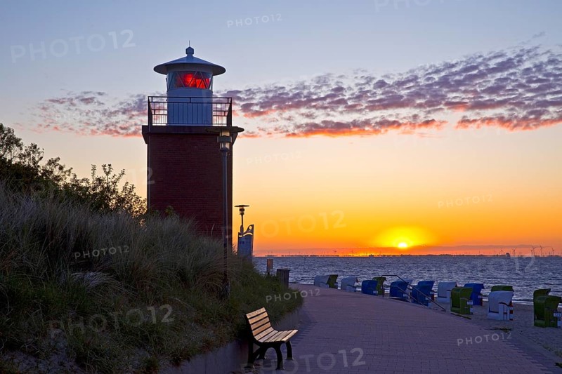 Olhörn lighthouse at colourful sunrise over the sea on the North Frisian island of Föhr, Schleswig-Holstein, Germany