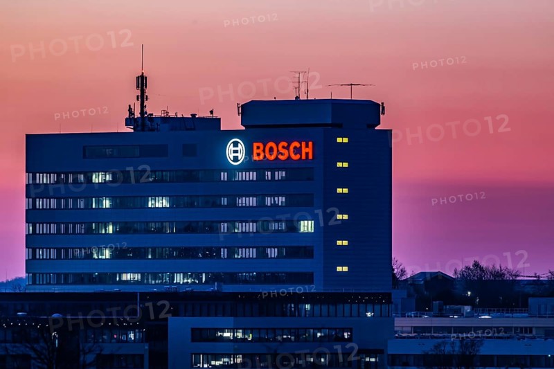 Bosch factory at sunset. Illuminated logo of the company. Schwieberdingen, Baden-Württemberg, Germany