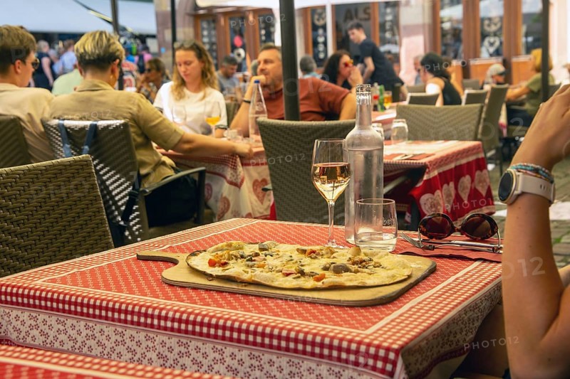 Alsatian tarte flambée in a street café in the historic centre of Strasbourg