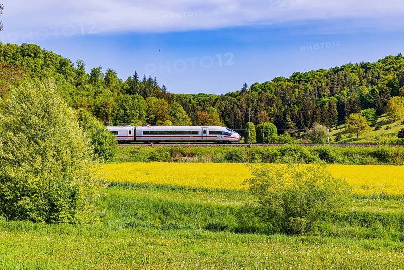 InterCityExpress ICE travelling across the Swabian Alb. Idyllic landscape in spring. Lonsee, Baden-Württemberg, Germany