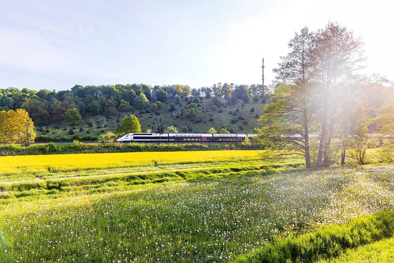 TGV travelling over the Swabian Alb. Idyllic landscape near Lonsee in spring at sunrise. Lonsee, Baden-Württemberg, Germany
