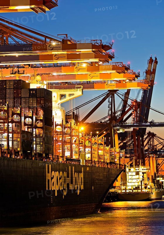 Container ships at the Eurogate container terminal in the evening with an atmospheric sunset, harbour, Hamburg, Germany