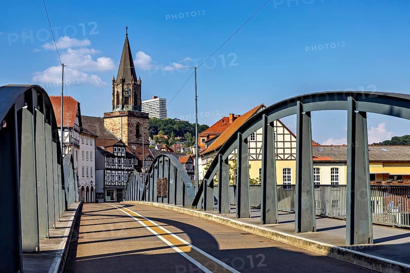 Modern bridge with a view of the church and half-timbered houses, blue sky, The town of Rotenburg an der Fulda