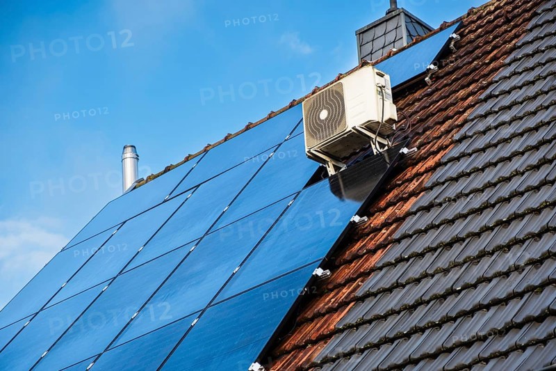 Solar panels and air conditioning on the roof of a detached house in Essen, Germany