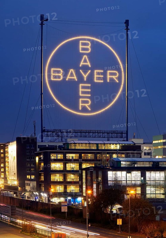 Bayer cross in the blue hour on the premises of Bayer AG, Leverkusen, Bergisches Land, North Rhine-Westphalia, Germany