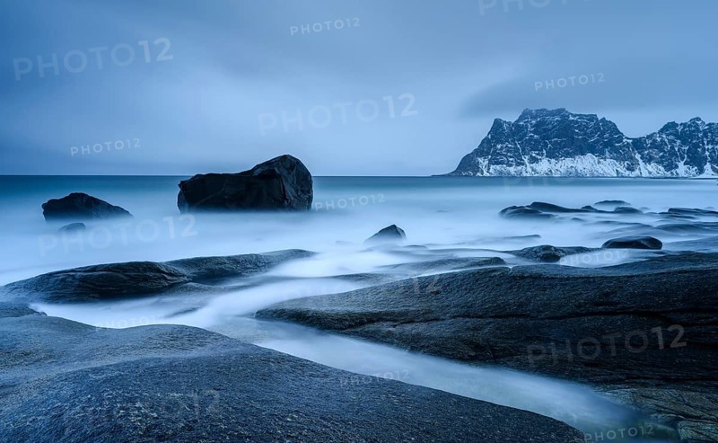 Blue Hour, rocks on the coast in Uttakleiv, Lofoten, Norway