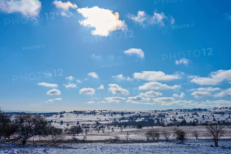 Wide, snow-covered landscape under a bright blue sky with clouds and sunlight, winter, Oberelsbach, Lange Rhön, Rhön, Bavaria, Germany