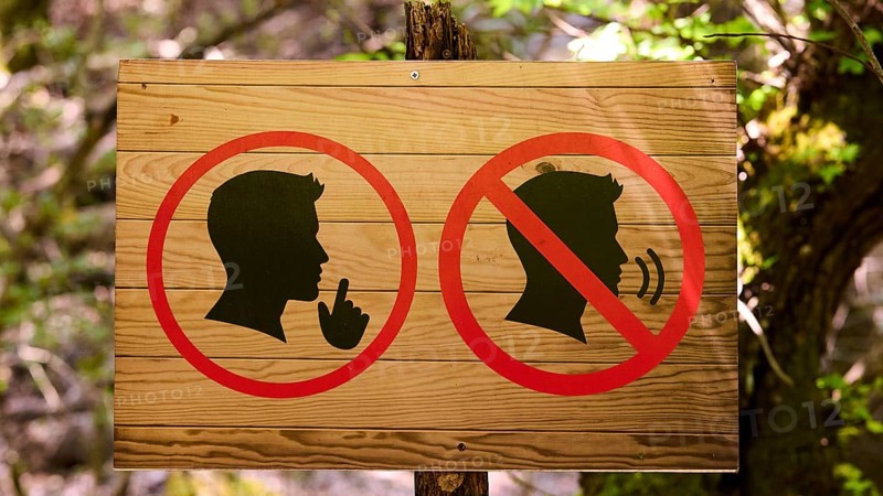Wooden sign in the forest with symbols indicating peace and tranquillity, Butterfly Valley, Butterfly Valley, Rhodes, Dodecanese, Greek Islands, Greece