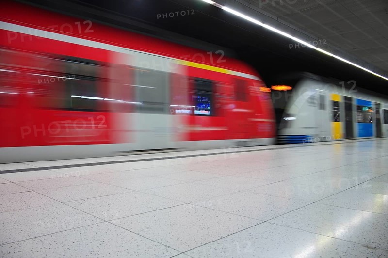 Underground arriving S-Bahn, train, class 420 in traffic red, coupled with Generation 2025, platform, stop, city centre station, public transport, movement effect, Stuttgart, Baden-Württemberg, Germany