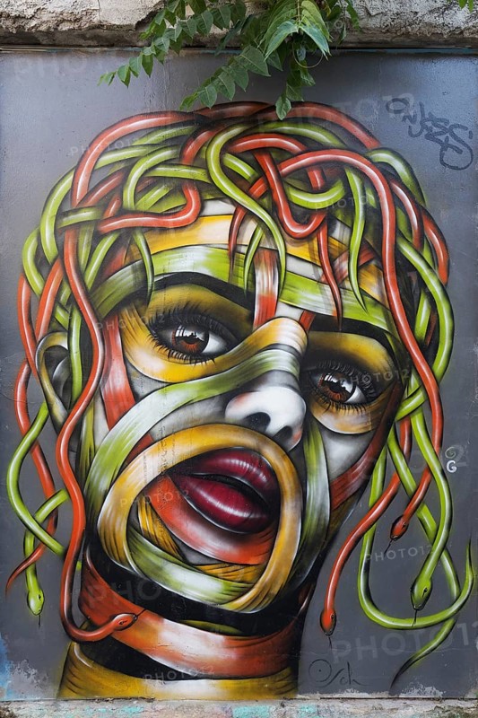 Medusa, female head with hair of colourful snakes, mural in the Anafiotika district, street art, Athens, Greece