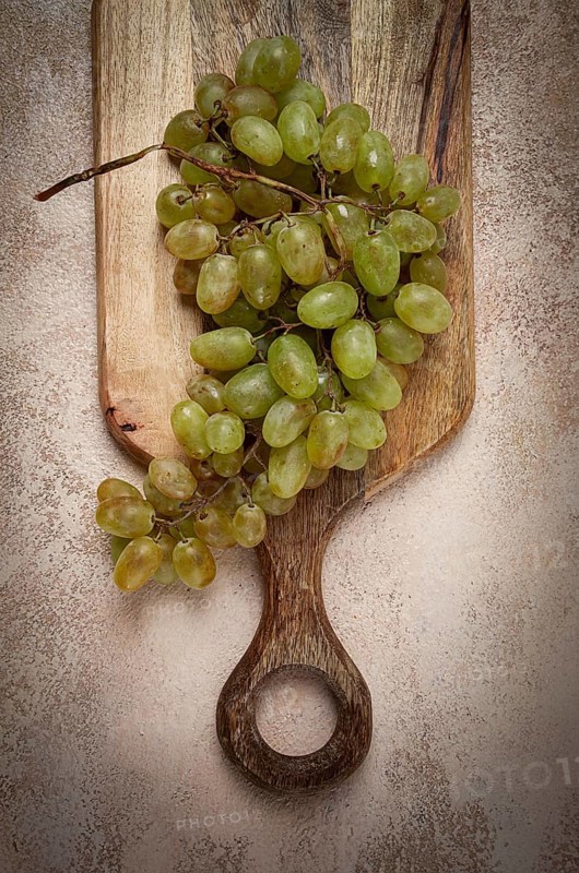 A branch of white grapes, wine grapes, Georgian grape variety Rkatsiteli, top view