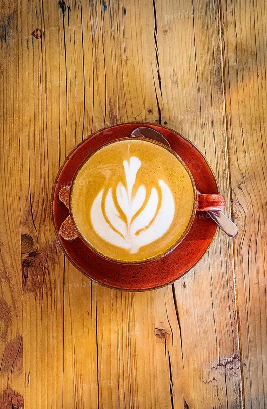 Cappuccino with floral pattern in milk foam, wooden table, coffee, cup, coffee mug, drink, caffeine gastronomy