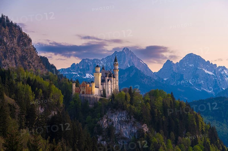 Neuschwanstein Castle romantic in front of an alpine evening mood, Schwangau near Füssen, Ostallgäu district, Swabia, Bavaria, Germany