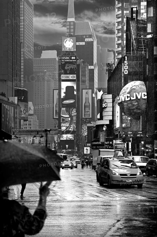 Evening Times Sqaure with illuminated advertising in the rain, New York City, USA