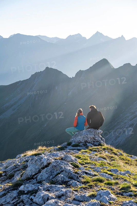 Hiker enjoying the mountain panorama in the morning, Venedigergruppe, Hohe Tauern, Austria
