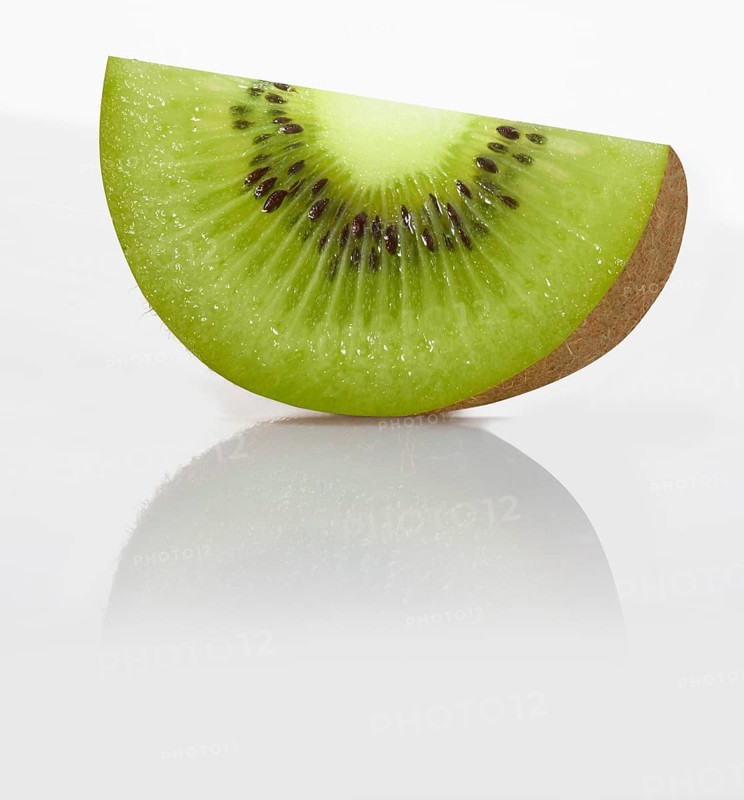 A quarter kiwi, kiwi fruit, Chinese gooseberry (Actinidia deliciosa) against a white background, studio photograph