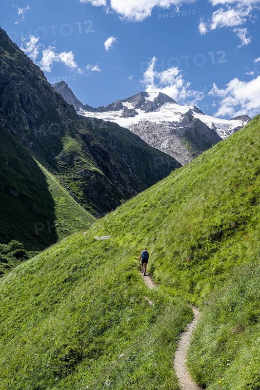 Hiker on hiking trail, view of Großer Schober and Rötspitze, Umbaltal, Hohe Tauern National Park, East Tyrol, Tyrol, Austria