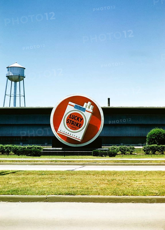 Lucky Strike cigarette advert, Philip Morris tobacco factory, probably in Durham, North Carolina. USA around 1953