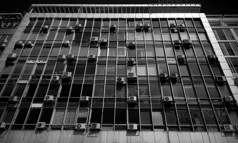 Air conditioners on house facade, black and white, Thessaloniki, Macedonia, Greece
