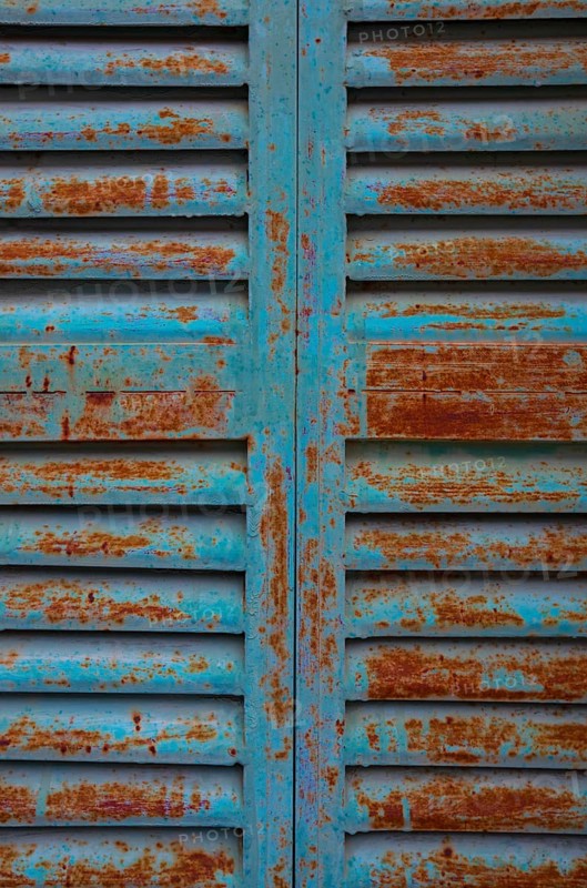Weathered blue and red window shutter, mountain village Lakkoi, Crete, Greece