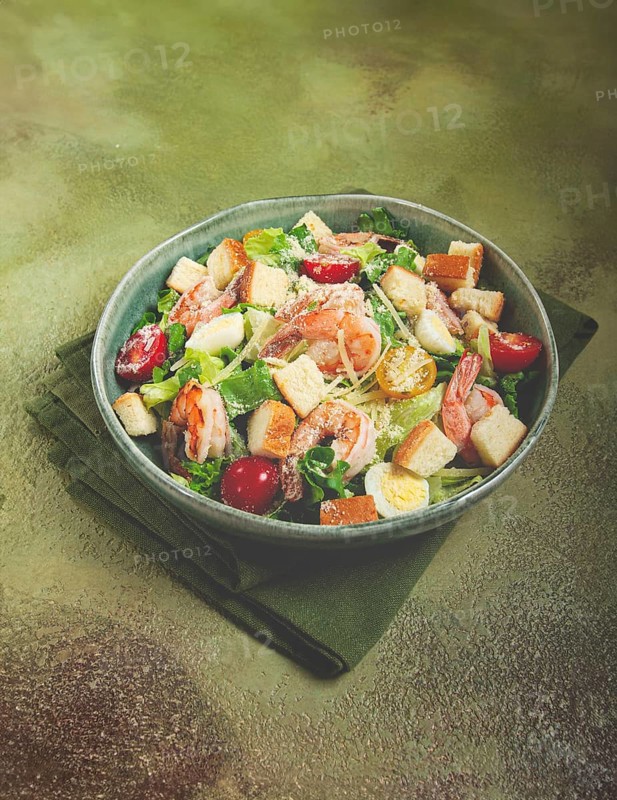 Caesar salad, with tiger prawns, shrimp salad, lettuce, quail eggs, cherry tomatoes, parmesan cheese, no people