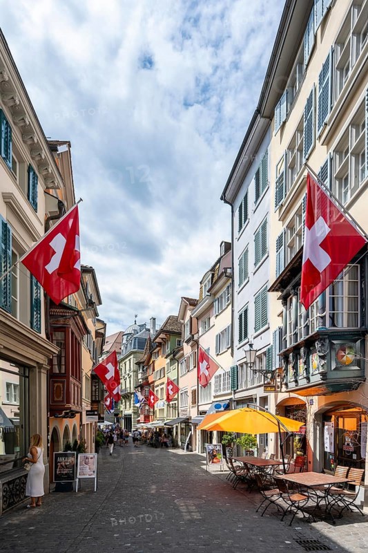 Augustinergasse with Swiss flags, alley with historic houses, Old Town, Zurich, Switzerland