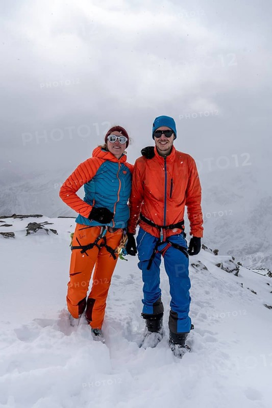Two ski tourers, couple on the summit of the Köllkuppe or Cima Marmota, snow-covered mountain landscape, Ortler Alps, Vinschgau, Italy
