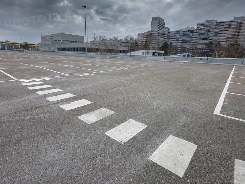 Symbolic image economic crisis, dark clouds in the sky, empty parking deck at Olympia-Einkaufszentrum OEZ, Pelkovenstraße, Munich, Bavaria, Germany