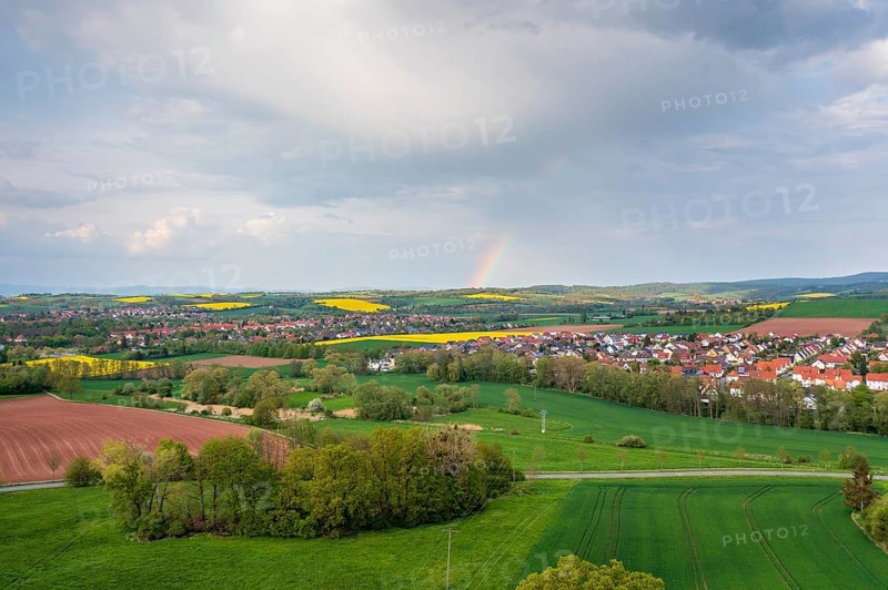 Aerial view with rainbow, city view of Duderstadt, in the foreground the district Gerblingerode, Lower Saxony, Germany