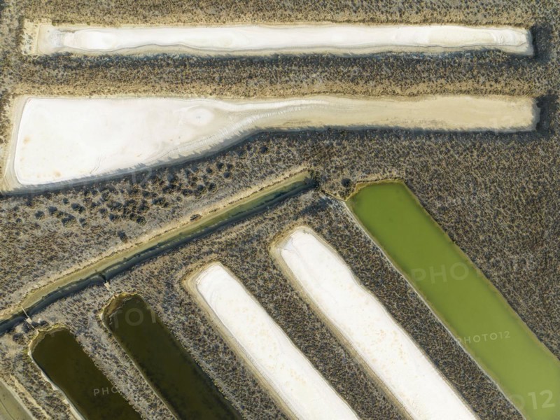 Saline ponds at the salt works near Chiclana de la Frontera. Aerial view. Drone shot. Cádiz province, Andalusia, Spain