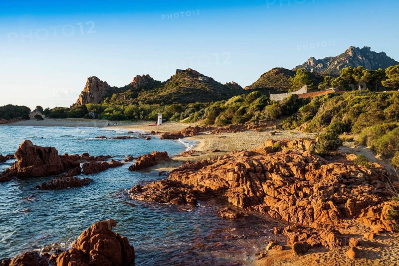 Lonely picturesque beach and red rocks, Spiaggia Su Sirboni, sunrise, near Tertenia, Province of Ogliastra, Sardinia, Italy