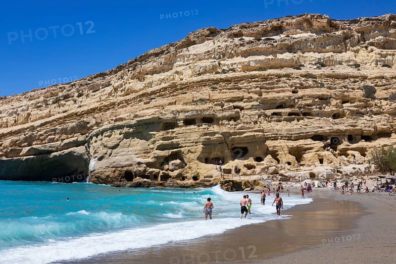 Matala beach with a view of the rock caves, south coast, Crete, Greece