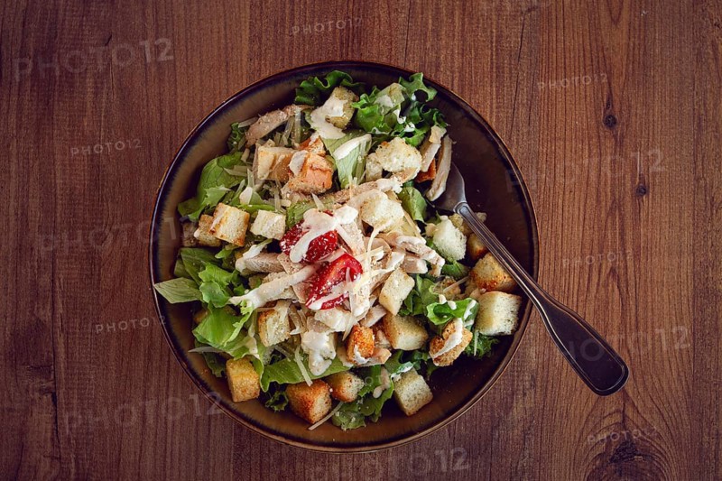 Classic Caesar salad, close-up, natural light, selective focus, horizontal