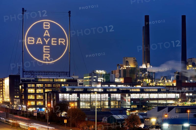 Bayer cross in the blue hour on the premises of Bayer AG, Leverkusen, Bergisches Land, North Rhine-Westphalia, Germany