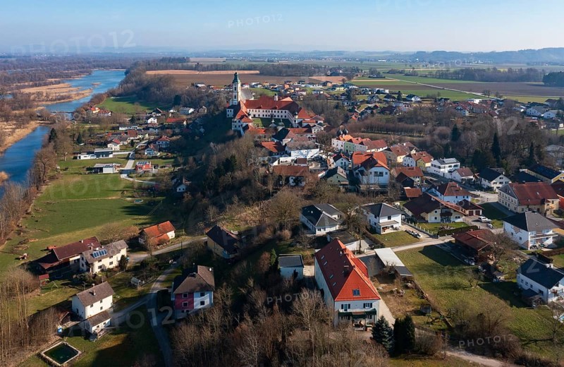 Drone shot, view of the village with Augustinian monastery Reichersberg, Reichersberg, Innviertel. Upper Austria, Austria