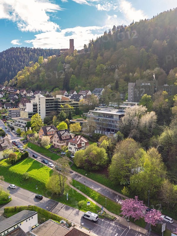 Townscape with surrounding forest and hills under a clear sky, Bad Liebenzell, district Calw, Black Forest, Germany
