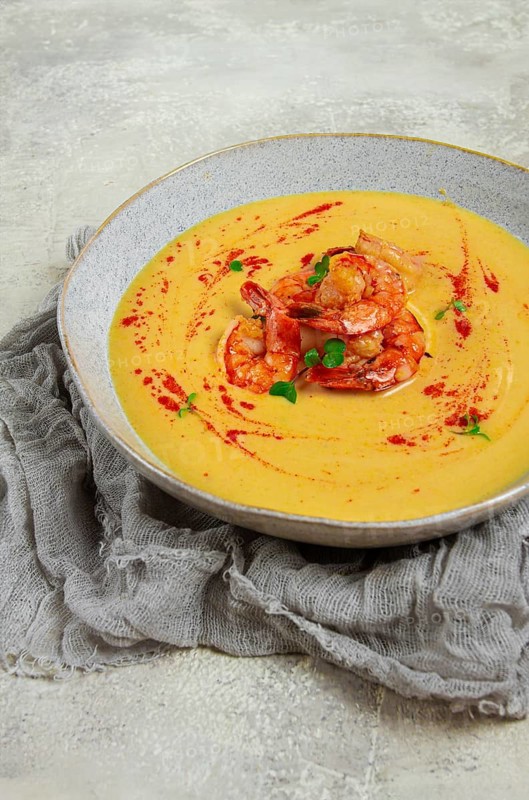 Pumpkin cream soup with shrimp, herbs and spices, homemade, no people