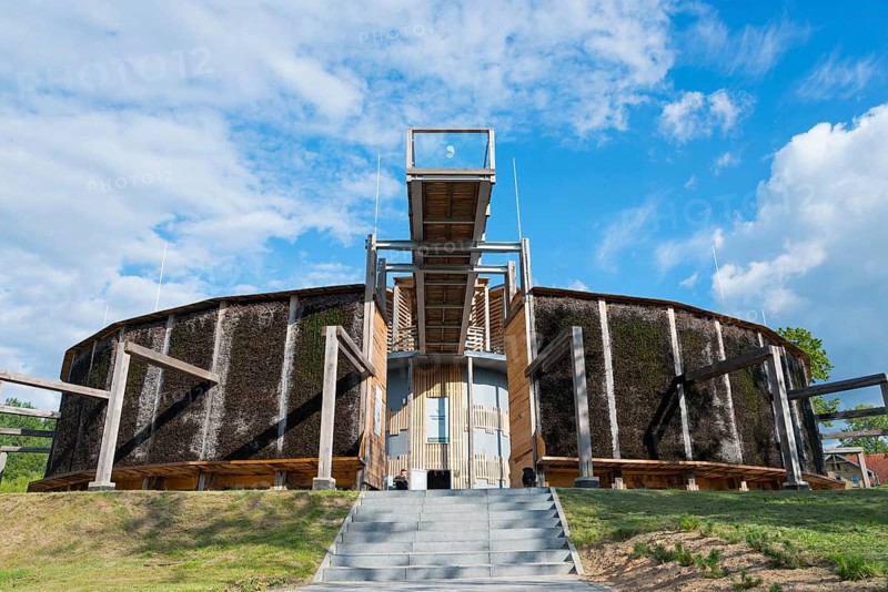 Round building made of wood and metal with stairs, blue sky and green landscape in the background, brine, graduation tower, spa town of Milomlyn, Milomlyn, Liebemühl, Warmia-Masuria, Poland