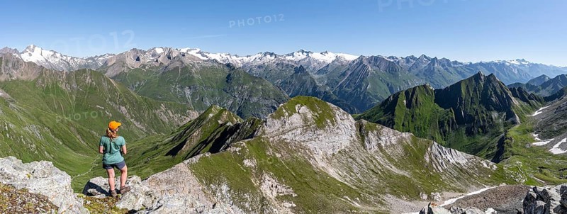 Mountaineer in front of mountain panorama with Großvenediger, mountain landscape with mountain peaks of the Venediger group, view from the summit of the Gösleswand, Lasörling group, Hohe Tauern National Park, East Tyrol, Tyrol, Austria