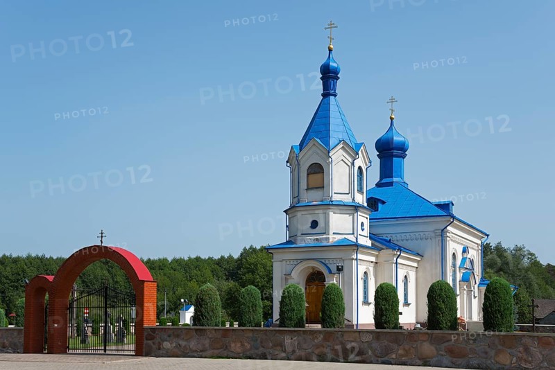 Orthodox church with blue roof and magnificent archway, surrounded by green landscape, Orthodox Church of the Assumption of the Virgin Mary, Dubiny, Podlaskie Voivodeship, Podlaskie, Poland