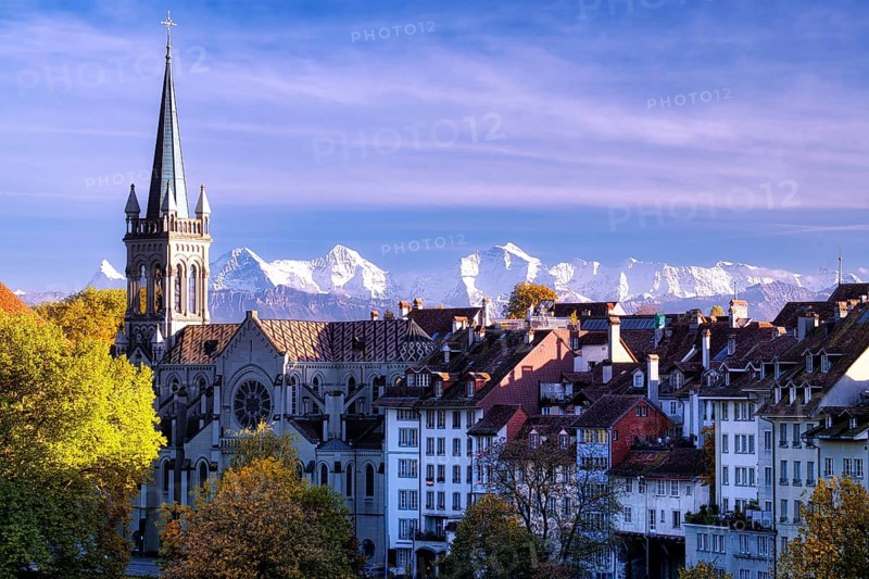 Bern's Old Town with St Peter and Paul Church, UNESCO World Heritage Site, snow-covered Bernese Alps behind, Canton of Bern, Switzerland