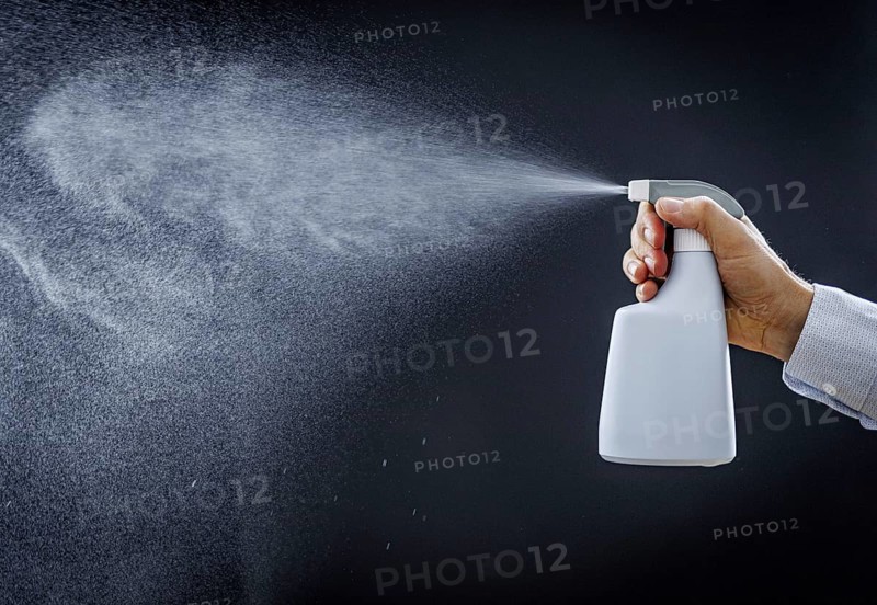 A man sprays a liquid into the air in Berlin, 09/08/2024