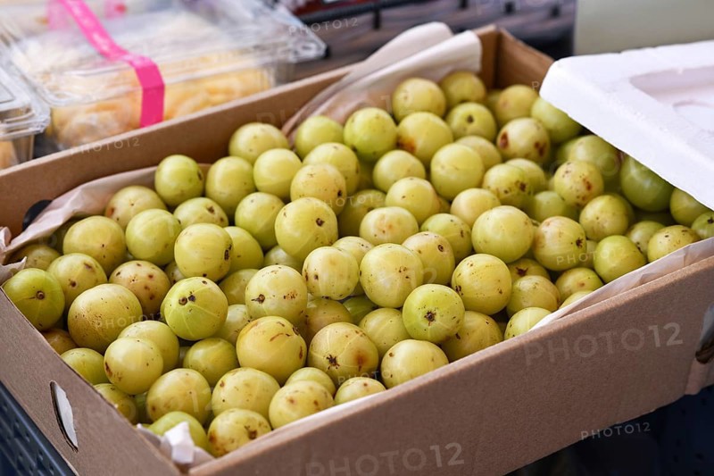 Cardboard box with 'Phyllanthus Emblica' Indian gooseberry fruits