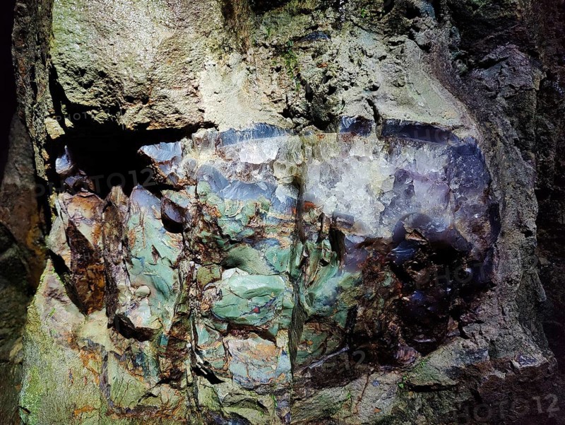 Green jasper with rock crystal in the visitor gallery of the Steinkaulenberg gemstone mines, Idar-Oberstein, Rheinpland-Pfalz, Germany