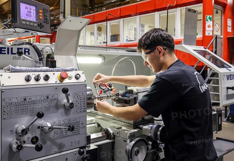 Oberhausen, North Rhine-Westphalia, Germany, Apprentices in metalworking professions. Apprentice at a machine tool in the MAN training centre. MAN Energy Solutions is a long-established company in the Ruhr region. Around 2, 000 employees build and develop compressors and turbines at the 250-year-old site in Oberhausen
