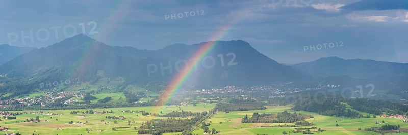 Panorama from the Grünten over the Illertal with rainbow to Blaichach and Immenstadt, behind Steineberg, 1660m and Mittagberg, 1451m, Allgäu Alps, Allgäu, Bavaria, Germany
