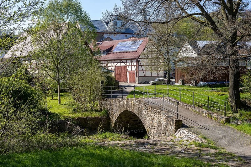 Historic bridge over the Triebisch, in the background the Furkert-Bartsch mill, Miltitz, Klipphausen, Saxony, Germany