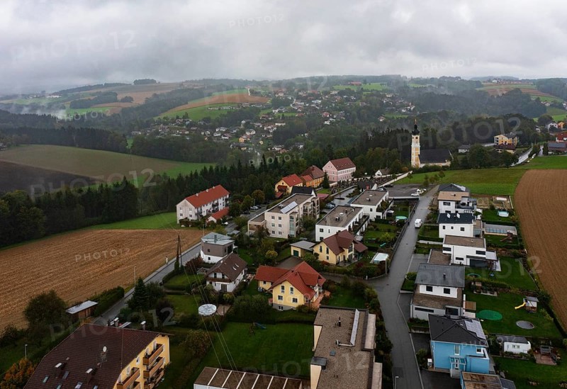 Drone image, residential buildings, view of village with church, Brunnenthal, Innviertel, Upper Austria, Austria