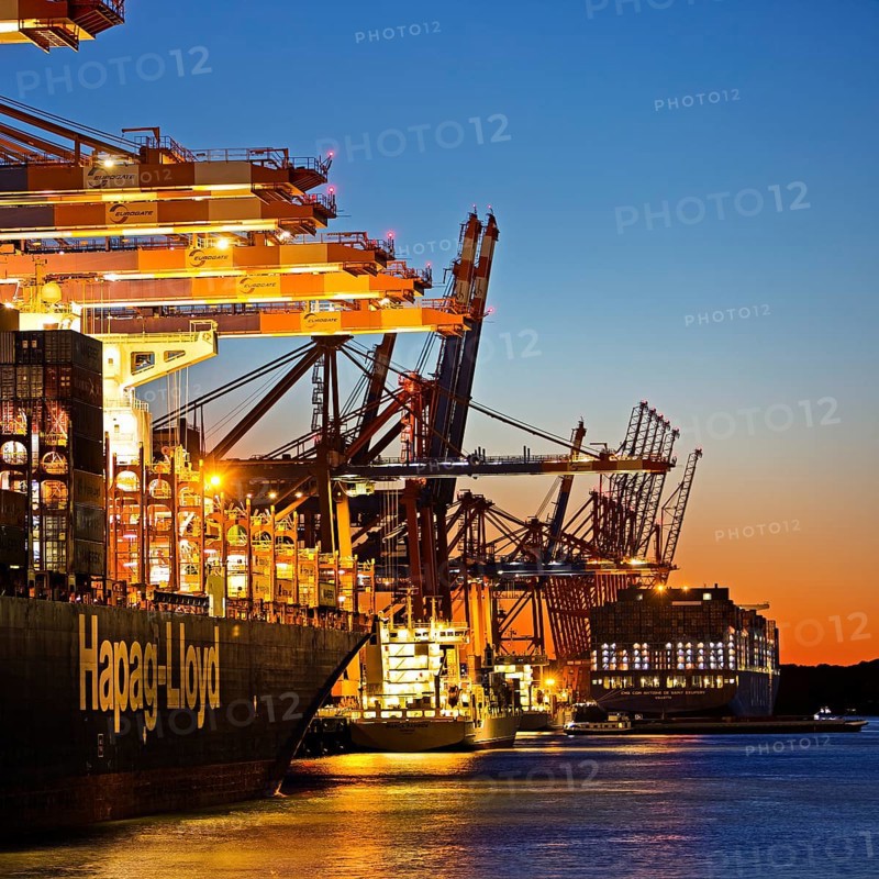 Container ships at the Eurogate container terminal in the evening with an atmospheric sunset, harbour, Hamburg, Germany