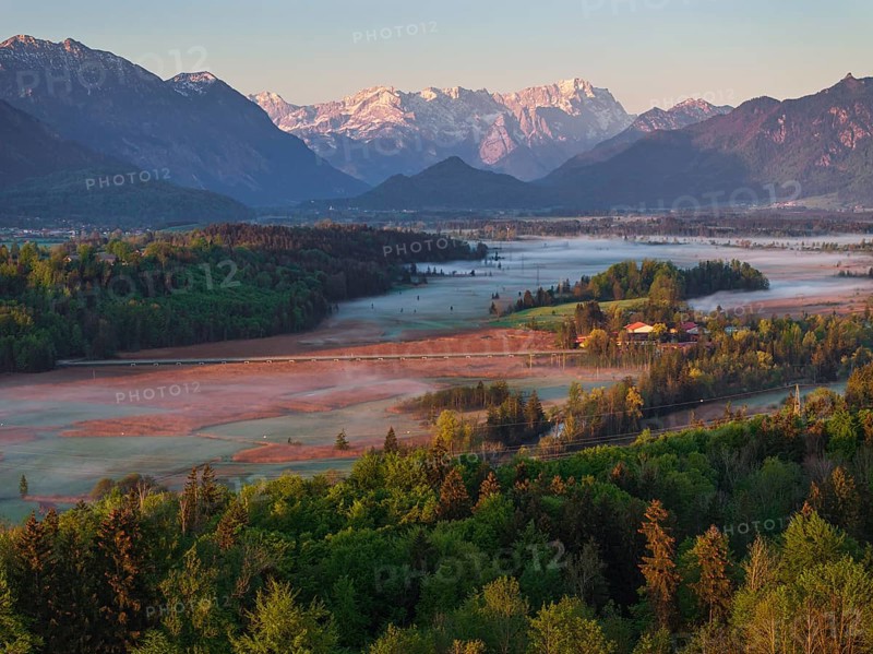 Aerial view, trees, forest, light green leaves, morning light, fog, mountains, sunny, spring, near Murnau, behind Zugspitze, Alpine foothills, Bavaria, Germany